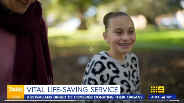 A child in a white and black patterned sweater standing in a park, with another person partially visible. Text overlay reads: ‘Today 8:46 VITAL LIFE-SAVING SERVICE – AUSTRALIANS URGED TO CONSIDER DONATING THEIR ORGANS’. The Channel 9 logo and Adelaide weather (14°C) are visible.