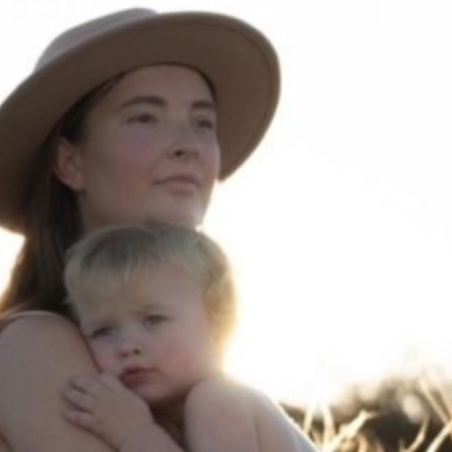 Emily holding her son