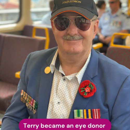 Person wearing a blue blazer with service medals, sunglasses and a military cap is seated on public transport, with the text “Terry became an eye donor” displayed across the bottom of the image.